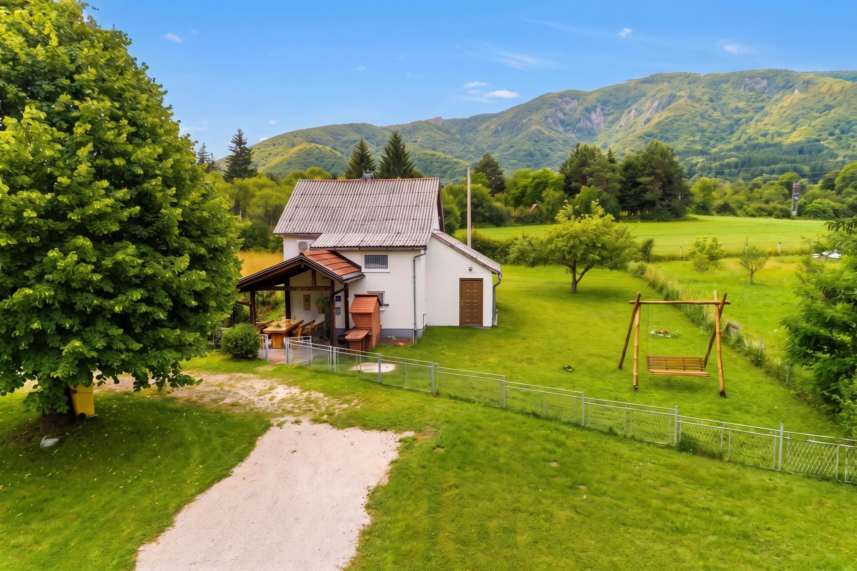 A house with a garden, a swing set, and a path leading to the house.