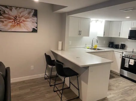 Microwave, oven, stovetop, dishwasher. Royale - Brand New & Cozy 1BR Basement @ Rosewood.