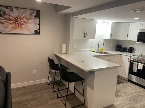 Microwave, oven, stovetop, dishwasher - Royale - Brand New & Cozy 1BR Basement @ Rosewood. (Saskatoon)