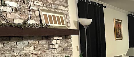 Smart TV, fireplace, books