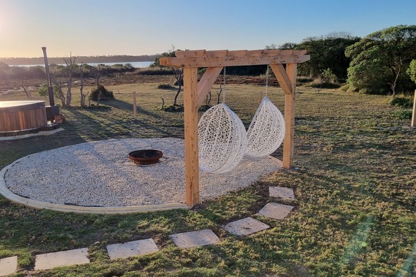 Backyard wood fired hot tub & outdoor swings.