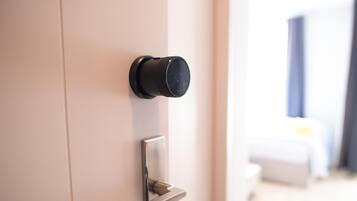 A modern door with a keyhole and a handle.