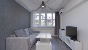 Family Apartment | Living area | Flat-screen TV