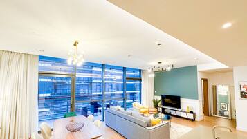 Luxury Apartment | Living area | 55-inch Smart TV with cable channels, TV
