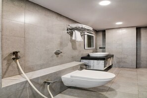 A modern bathroom with a toilet, sink, and shower. - FabHotel Seventy Seven (Barakpur)