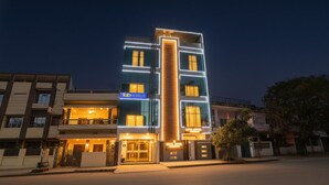 A modern hotel with a prominent vertical light strip and a sign reading "Tab Hotels". - FabHotel Super 3 Premium - 800m from Kashi Vishwanath Temple (Varanasi)