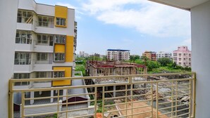 A view of a building under construction with visible scaffolding and construction materials. - FabHotel Amar Raj Villa (Barasat)