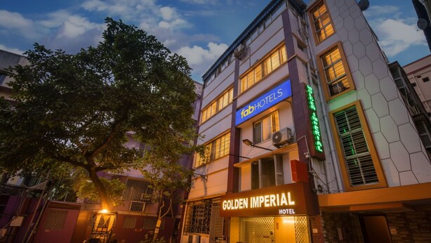 A hotel with a sign reading "Golden Imperial Hotel" and another sign for "fabHOTELS". - FabHotel Golden Imperial (Kolkata)