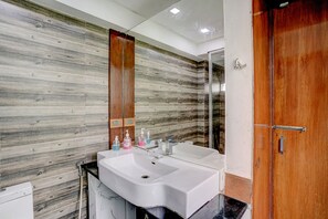 Deluxe Room | Bathroom | Shower, rainfall showerhead, free toiletries, towels - FabHotel Vardhan House I (Pune)