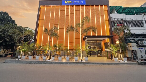 A modern building with a prominent sign for 'Fab Hotels'. - FabHotel Yellow Courtyard (Bhopal)
