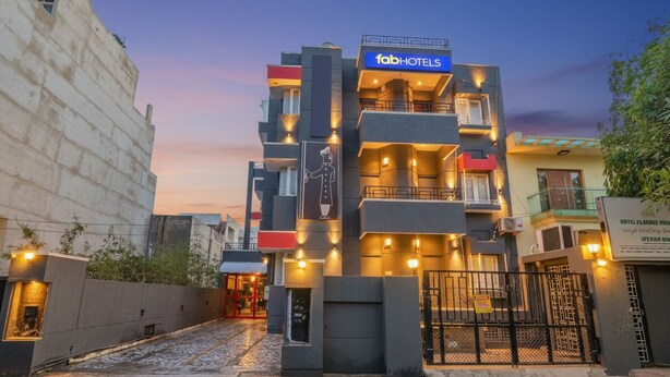 A multi-story building with a 'fab hotels' sign, featuring balconies and a gated entrance. - FabHotel Classic Holiday (Jaipur)