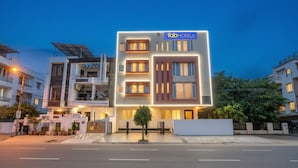 A modern hotel with a flat roof, solar panels, and a well-lit facade. - Fabhotel Shiv Rachna (Jaipur)