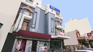 A multi-story building with a 'Tab Hotels' sign, a 'Boris' sign, and a 'Boris' sign with a red background. - Fabhotel Royal Touch (New Delhi)