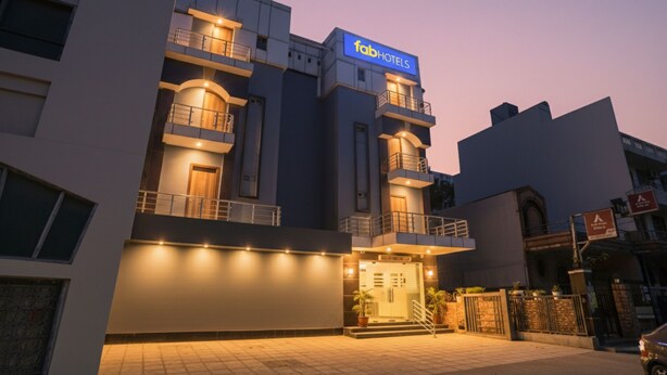 A modern building with a prominent 'fab hotels' sign, multiple balconies, and a gated entrance. - Fabhotel Royal Touch (New Delhi)