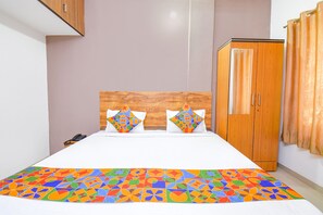 Egyptian cotton sheets, premium bedding, in-room safe, desk - FabExpress Wakad Stays (Paud)