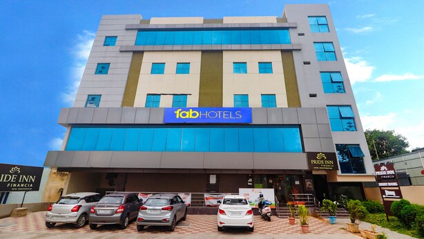 A multi-story hotel with a prominent 'Fab Hotels' sign. - Fabhotel Pride Inn Financia (Hyderabad)