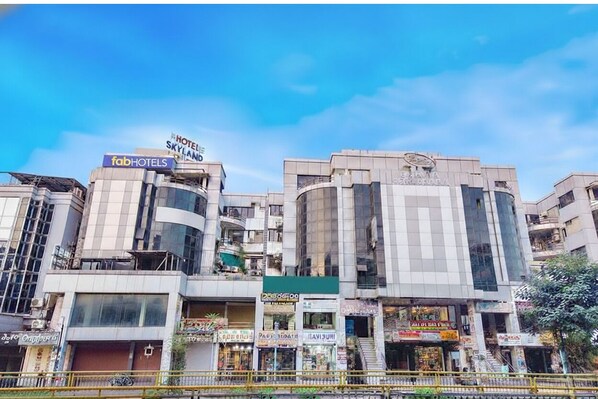 A hotel with a sign for 'fabHOTELS' and 'HOTEL SKYLAND'.