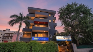 A modern multi-story hotel with balconies, a sign for 'Fab Hotels', and a sign for 'The Destination'. - Fabhotel Destiny Inn (Gurugram)