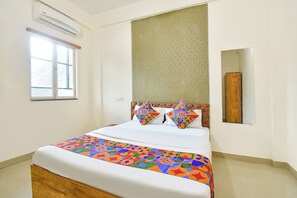 Egyptian cotton sheets, premium bedding, in-room safe, desk - FabHotel Tiru Rooms (Pune)