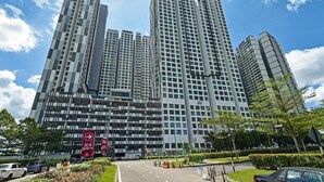 A high-rise building with multiple floors, large windows, and a clear sky. - D'Summit Residences by YML Home B1 (Johor Bahru)