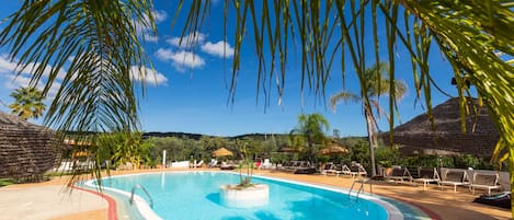 Seasonal outdoor pool, open 8:30 AM to 8:00 PM, pool umbrellas
