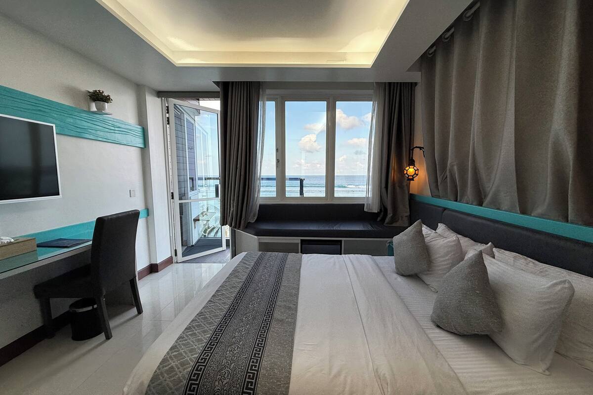 Deluxe Double Room, 1 Queen Bed, Balcony, Beach View | In-room safe, desk, laptop workspace, soundproofing