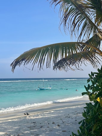 On the beach, white sand, beach towels