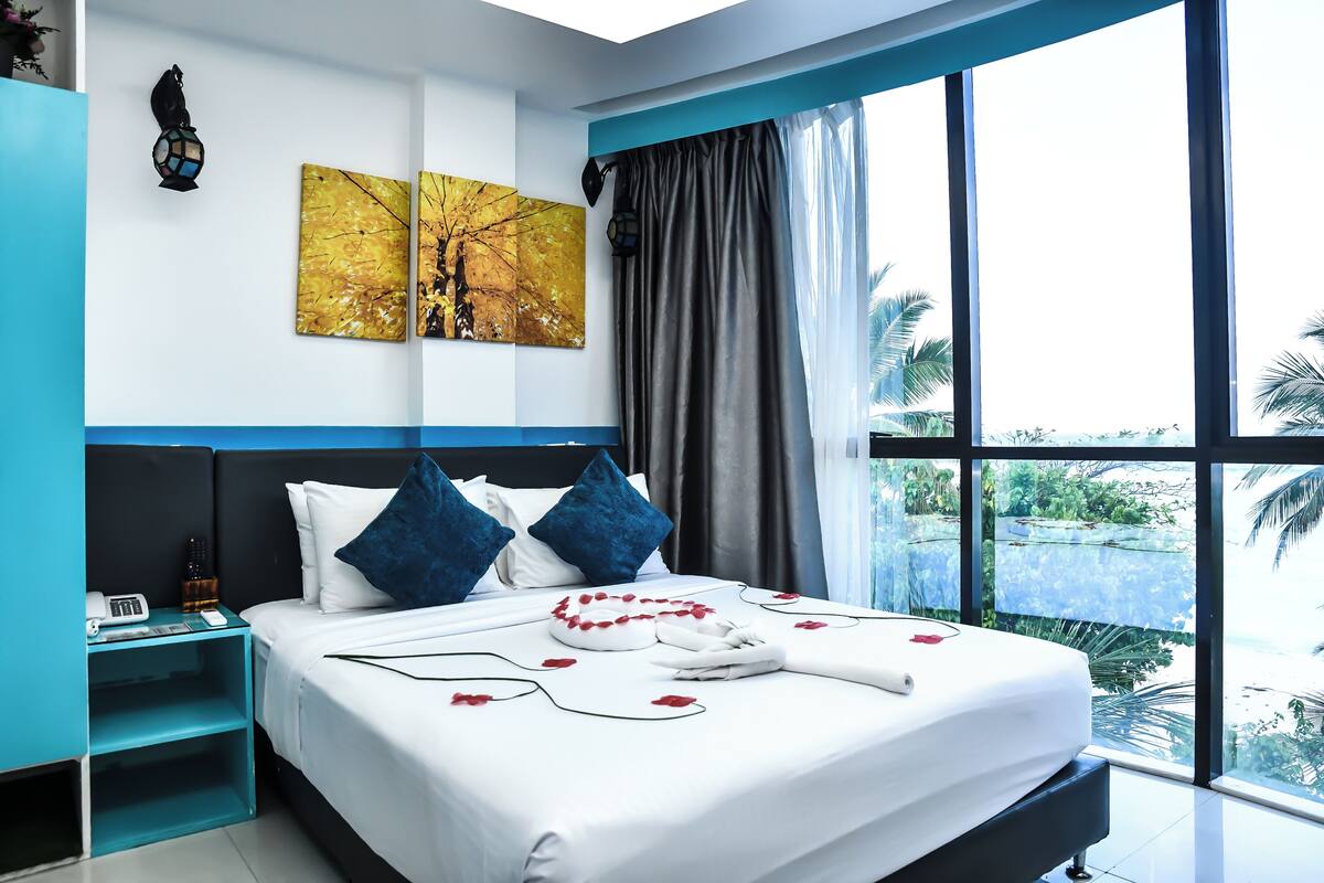 Deluxe Double Room, 1 Queen Bed, Beach View | In-room safe, desk, laptop workspace, soundproofing
