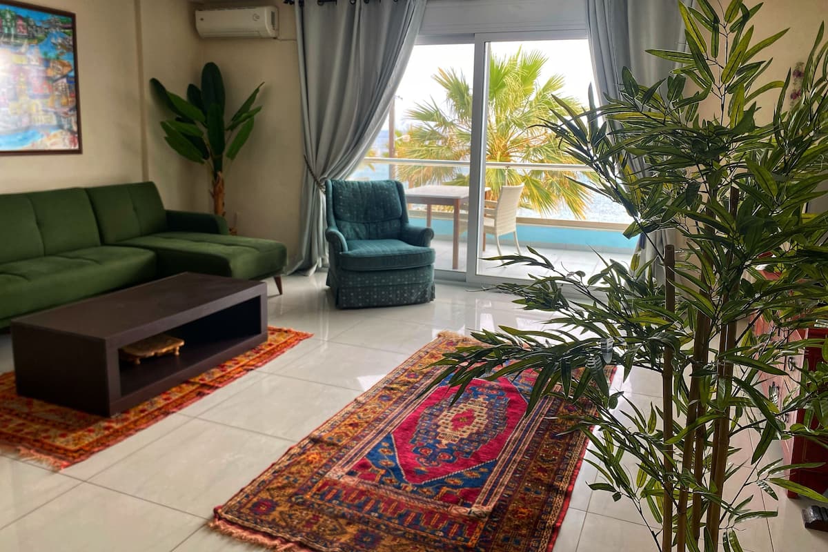 Sea View Family Suite | Living area | 30-inch flat-screen TV with digital channels, TV