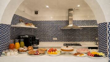 A breakfast buffet with various food items and beverages.