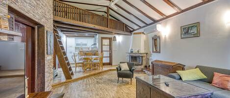 Family House, 2 Bedrooms (Wellness House On The River Kupa) | Living room | Flat-screen TV, fireplace