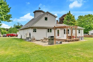 A two-story house with a covered porch, a satellite dish, and a chimney. - Walk To Wells Harbor! Ping Pong Table & Large Yard (Wells)
