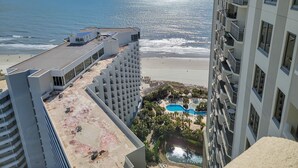 A high-rise hotel overlooking a beach with a pool and a view of the ocean. - 2307 Royale Palms 3 Bedroom Condo (Myrtle Beach)