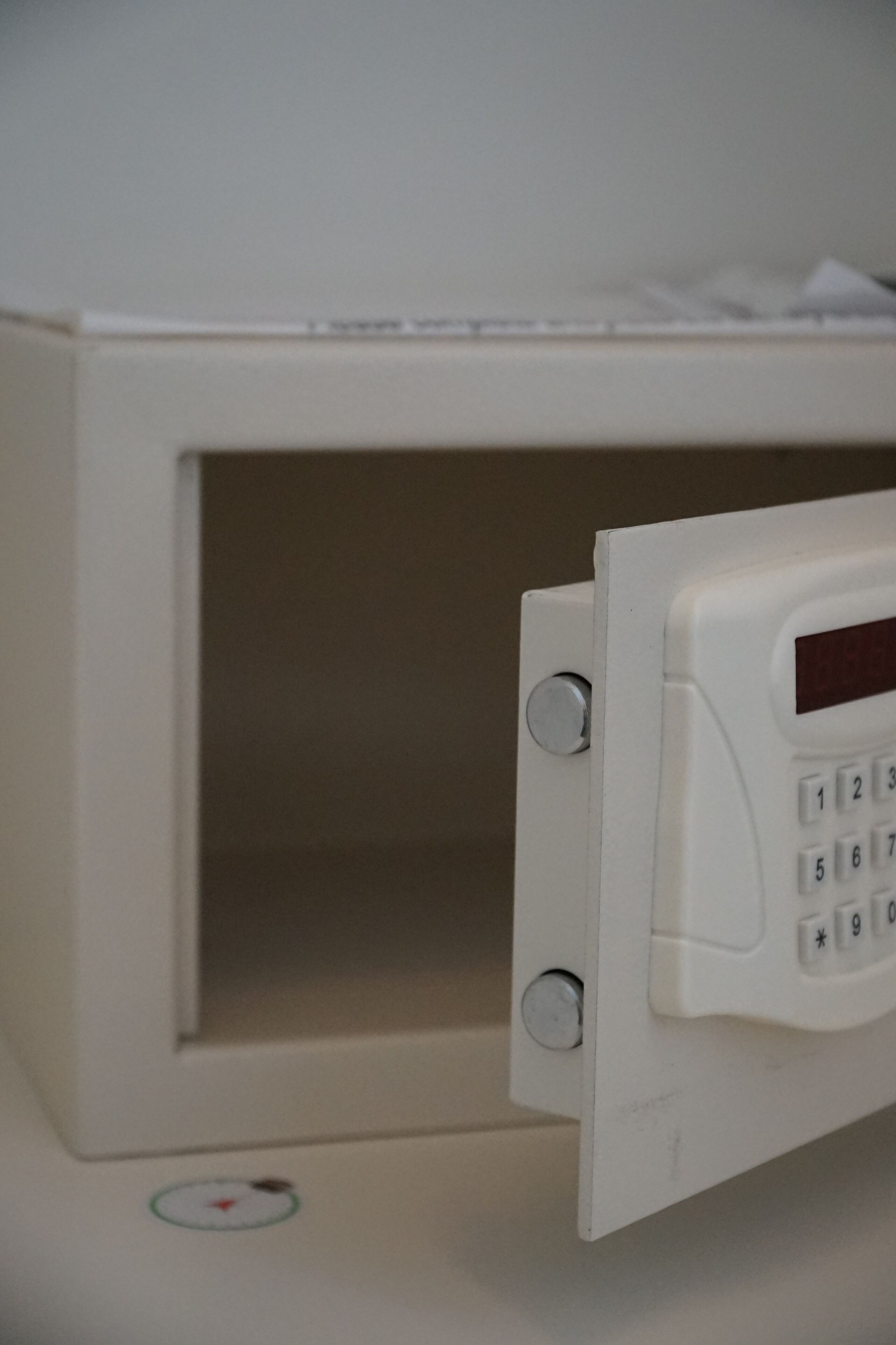A microwave with a keypad and a small display.