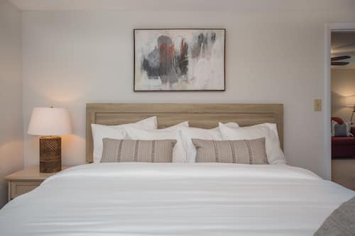Suite, 1 Bedroom, Pool View | Iron/ironing board, free WiFi, bed sheets