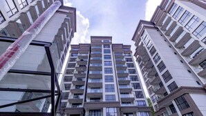 A high-rise residential building with multiple balconies, large windows, and a modern architectural design. - Maya 3-bed Apartment in Nairobi (Nairobi)