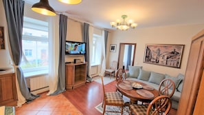 Comfort Apartment | Living area | 50-inch LCD TV with digital channels, TV, Netflix