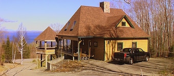 Dog-friendly, lake-view chalet with gazebo, wraparound deck, grill, & fireplace