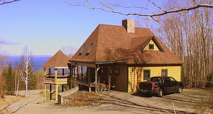 Dog-friendly, lake-view chalet with gazebo, wraparound deck, grill, & fireplace