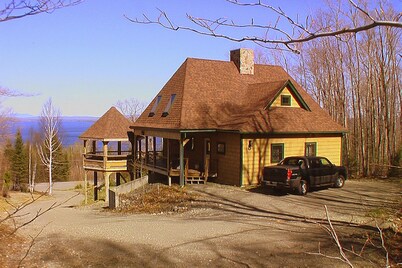 Dog-friendly, lake-view chalet with gazebo, wraparound deck, grill, & fireplace