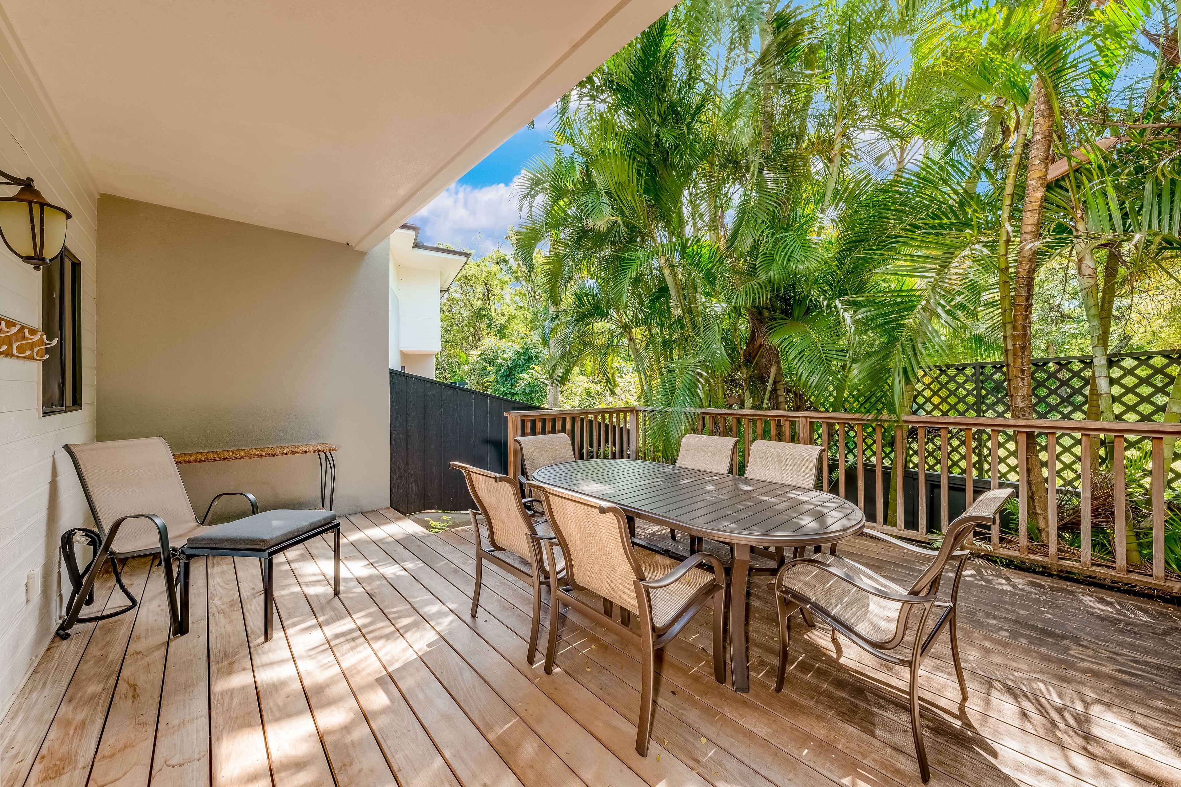 Tropical townhome with a large deck, grill, beach gear, & AC - near the beach