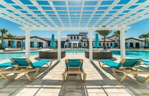 A heated pool, sun loungers