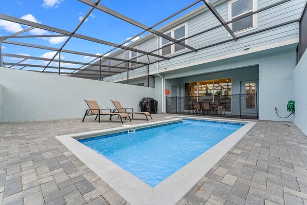 A heated pool, sun loungers