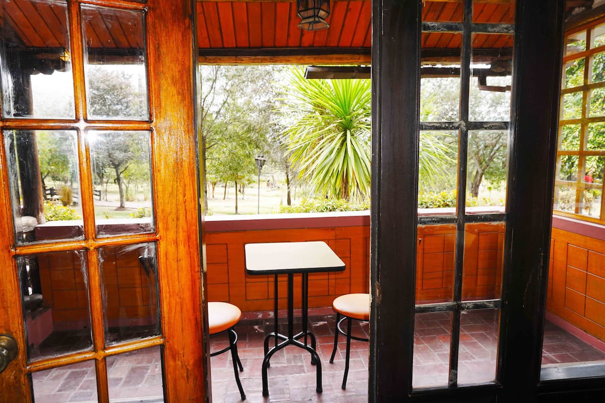 Suite Deluxe, Terraza, vista al jardín | Vista a la montaña