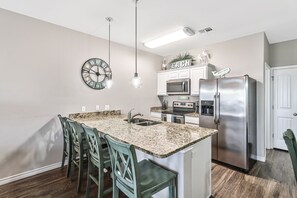 Fridge, microwave, oven, stovetop - Water view townhome with pool & private balcony - walk to beach & jetty (Corpus Christi)