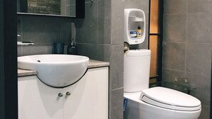 A modern bathroom with a white sink, mirror, and toilet. - Sweetheart in Saigon - 5mins to the Notre Dame Saigon (Thành phố Hồ Chí Minh)