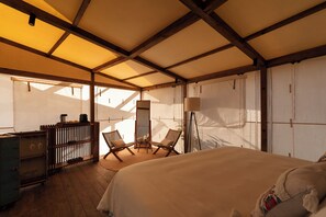 A tented room with a bed, two chairs, a small table, and a cabinet. - Viatura Hacienda Xtojil, Yucatan, Merida, with Optional All Inclusive (Timucuy)