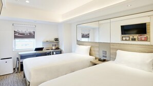 A hotel room with two beds, a desk with a laptop, a TV, and a window with a cityscape view. - Red Planet Sapporo Susukino Central (Sapporo)