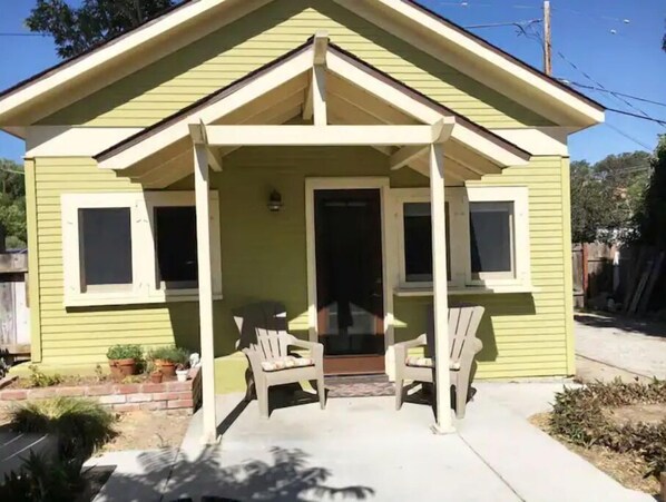 Charming single-story house with a gabled roof and inviting front porch.