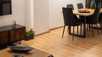 Exclusive Apartment | Living area | 55-inch Smart TV with cable channels, TV
